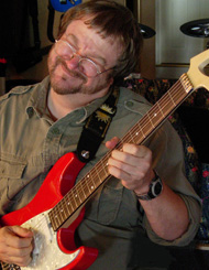 Scotty West improvises on his red guitar, he know that soloing is more than just knowing where to put your fingers.